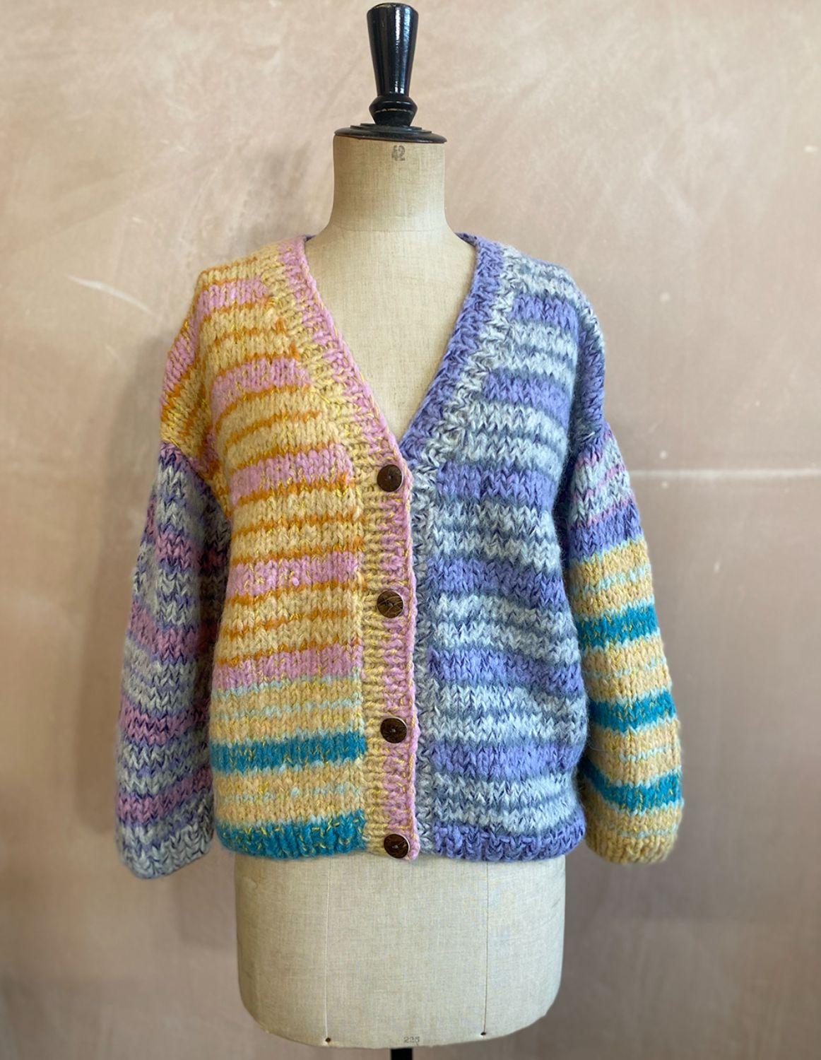 Striped Alpaca Cardigan in Buttermilk with a pastel pink